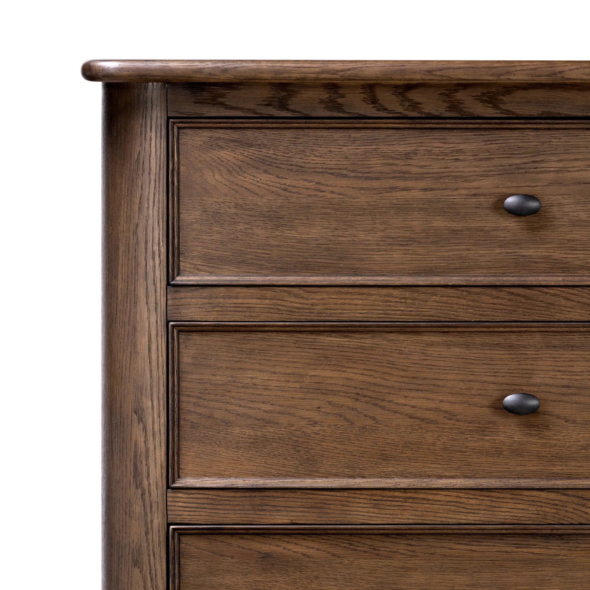 Like an heirloom tallboy with six drawers, this aged oak dresser has room for it all. Detailed with an overhang surface, carved edges top to bottom, angled legs and oval drawer pulls finished in dark gunmetal.Collection: Bolto Amethyst Home provides interior design, new home construction design consulting, vintage area rugs, and lighting in the Houston metro area.
