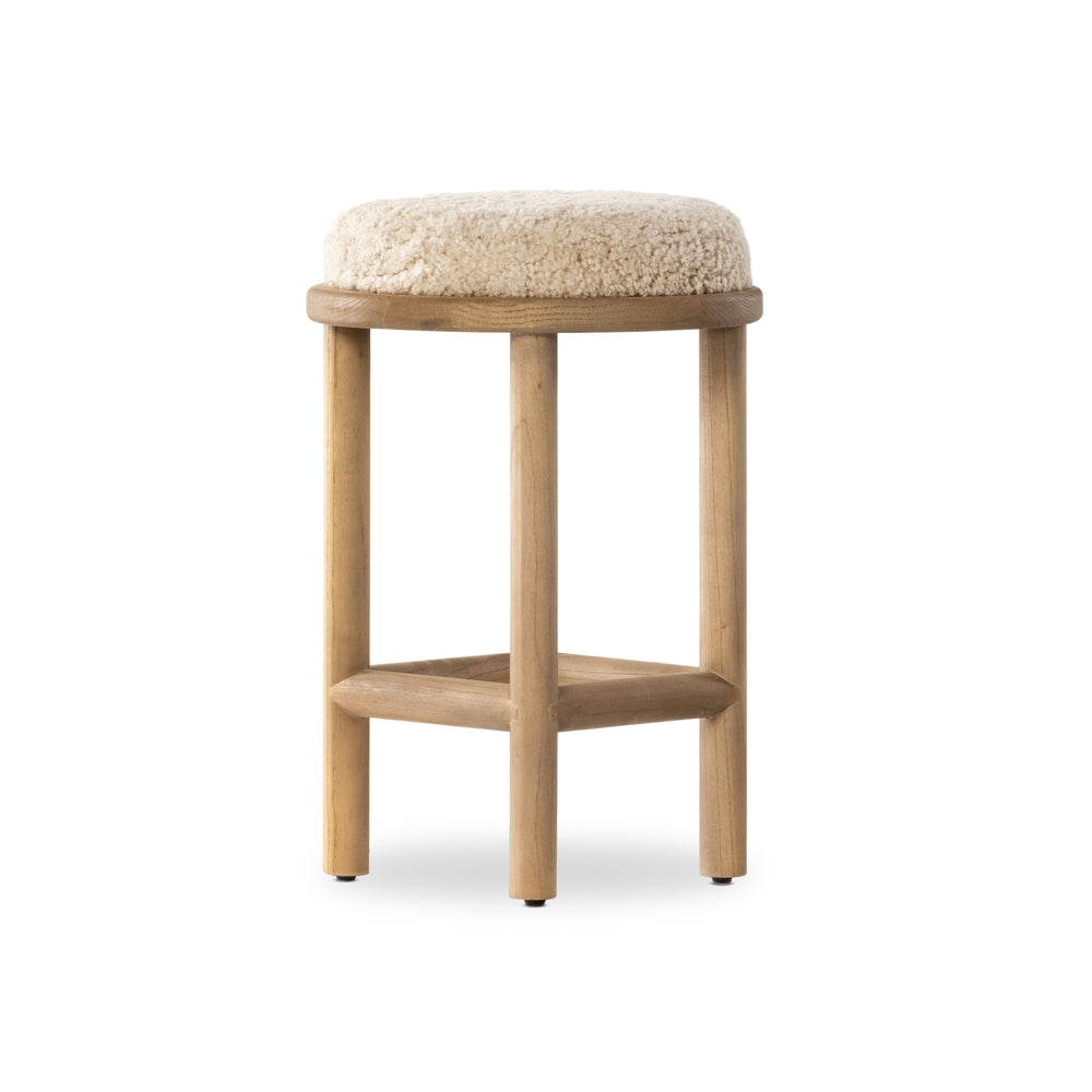 Featuring Saldino Stool by Four Hands at Amethyst Home. Bring a textural touch to the counter with the Saldino stool. Blonde-finished solid parawood supports rounded seating of soft beige shearling for comfort and style alike.
Overall Dimensions: 17"W x 17"L x 26"HColors: Blonde Nettlewood, Beige ShearlingMaterials: Solid Nettlewood, Shearling Weight: 15.2. Amethyst Home provides interior design, new home construction design consulting, vintage area rugs, and lighting in the Alpharetta metro area.