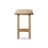 Bring a textural touch to the counter with the Saldino stool. Blonde-finished solid parawood supports rounded seating of soft beige shearling for comfort and style alike. Amethyst Home provides interior design, new home construction design consulting, vintage area rugs, and lighting in the Houston metro area.