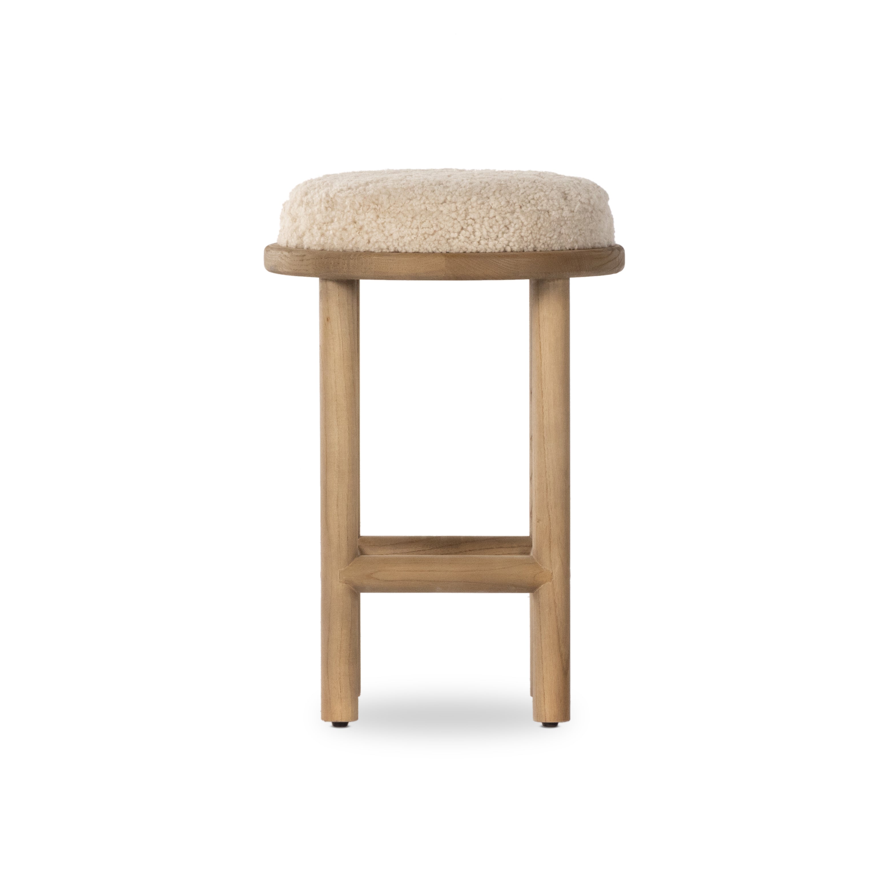Bring a textural touch to the counter with the Saldino stool. Blonde-finished solid parawood supports rounded seating of soft beige shearling for comfort and style alike. Amethyst Home provides interior design, new home construction design consulting, vintage area rugs, and lighting in the Houston metro area.