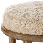 Bring a textural touch to the counter with the Saldino stool. Blonde-finished solid parawood supports rounded seating of soft beige shearling for comfort and style alike. Amethyst Home provides interior design, new home construction design consulting, vintage area rugs, and lighting in the Laguna Beach metro area.