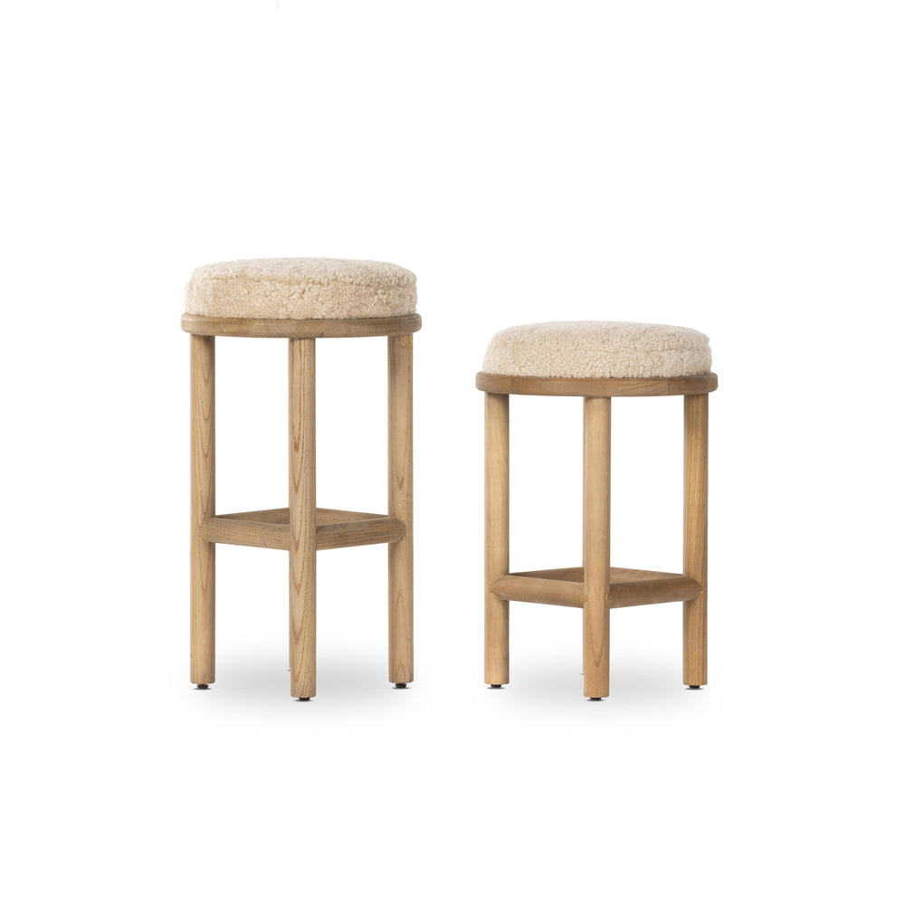 Featuring Saldino Stool by Four Hands at Amethyst Home. Bring a textural touch to the counter with the Saldino stool. Blonde-finished solid parawood supports rounded seating of soft beige shearling for comfort and style alike.
Overall Dimensions: 17"W x 17"L x 26"HColors: Blonde Nettlewood, Beige ShearlingMaterials: Solid Nettlewood, Shearling Weight: . Amethyst Home provides interior design, new home construction design consulting, vintage area rugs, and lighting in the Salt Lake City metro area.