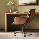 This comfort-driven take on the modern desk chair features velvety cocoa-colored upholstery, pared with a wooden frame. Casters and seat height adjustability for ease as you work. Amethyst Home provides interior design, new construction, custom furniture, and area rugs in the Los Angeles metro area.