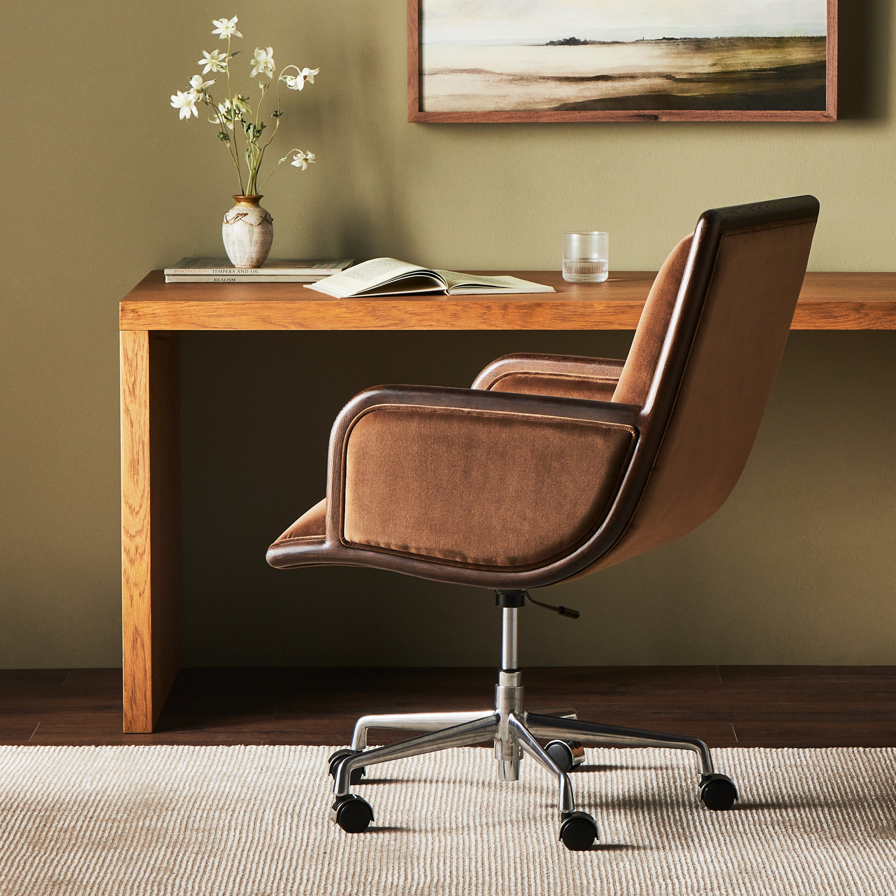 This comfort-driven take on the modern desk chair features velvety cocoa-colored upholstery, pared with a wooden frame. Casters and seat height adjustability for ease as you work. Amethyst Home provides interior design, new construction, custom furniture, and area rugs in the Portland metro area.