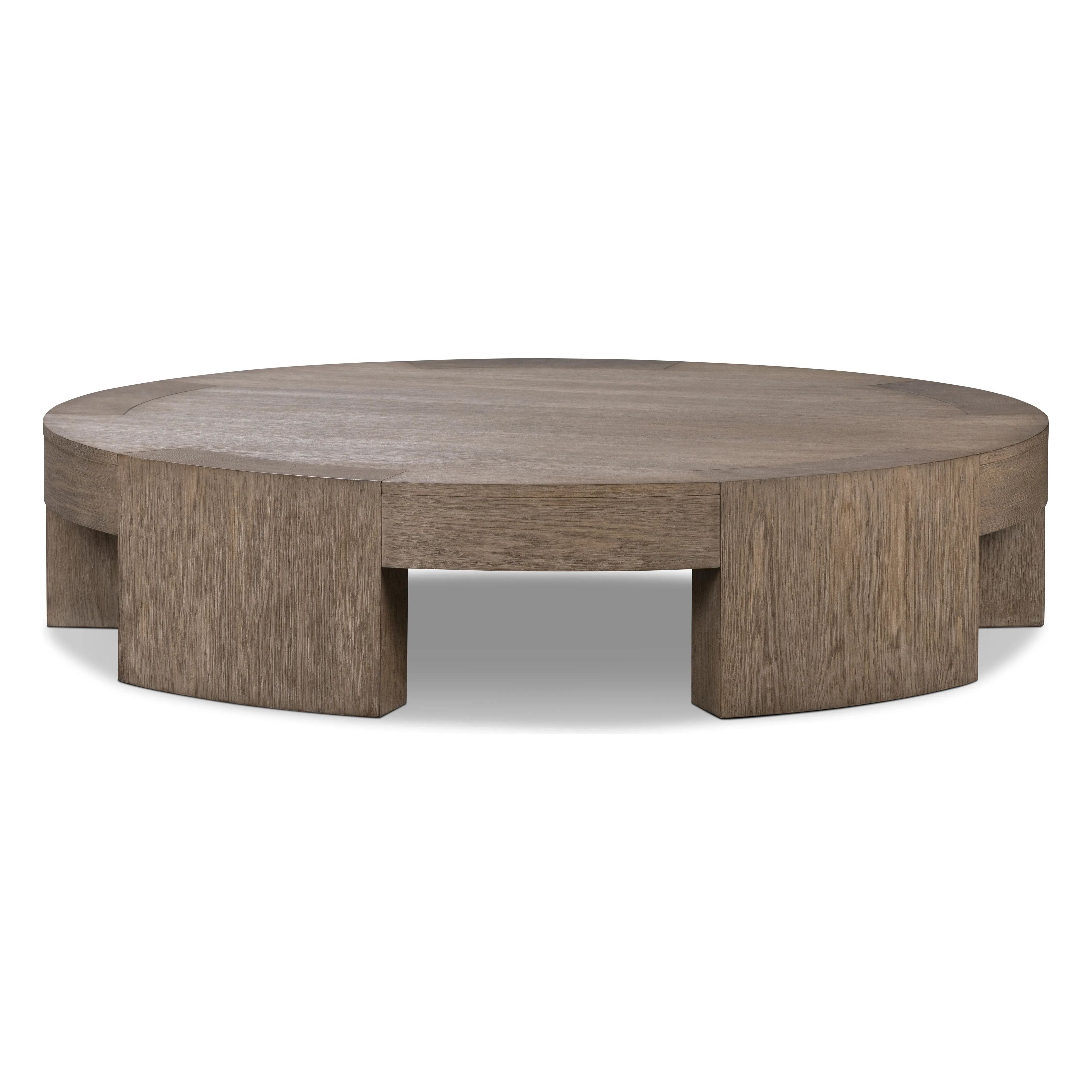 A simple stunner. This large coffee table features exposed joinery from five thick, gently curved legs. Crafted from a beautiful oak veneer with exposed graining throughout.Collection: Irondal Amethyst Home provides interior design, new home construction design consulting, vintage area rugs, and lighting in the Omaha metro area.