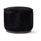 This round ottoman can be placed just about anywhere, bringing with it a hip retro vibe. Covered in soft and luminous black hair-on hide, which is naturally warm and textural with authentic highlights. Amethyst Home provides interior design, new construction, custom furniture, and area rugs in the Calabasas metro area.