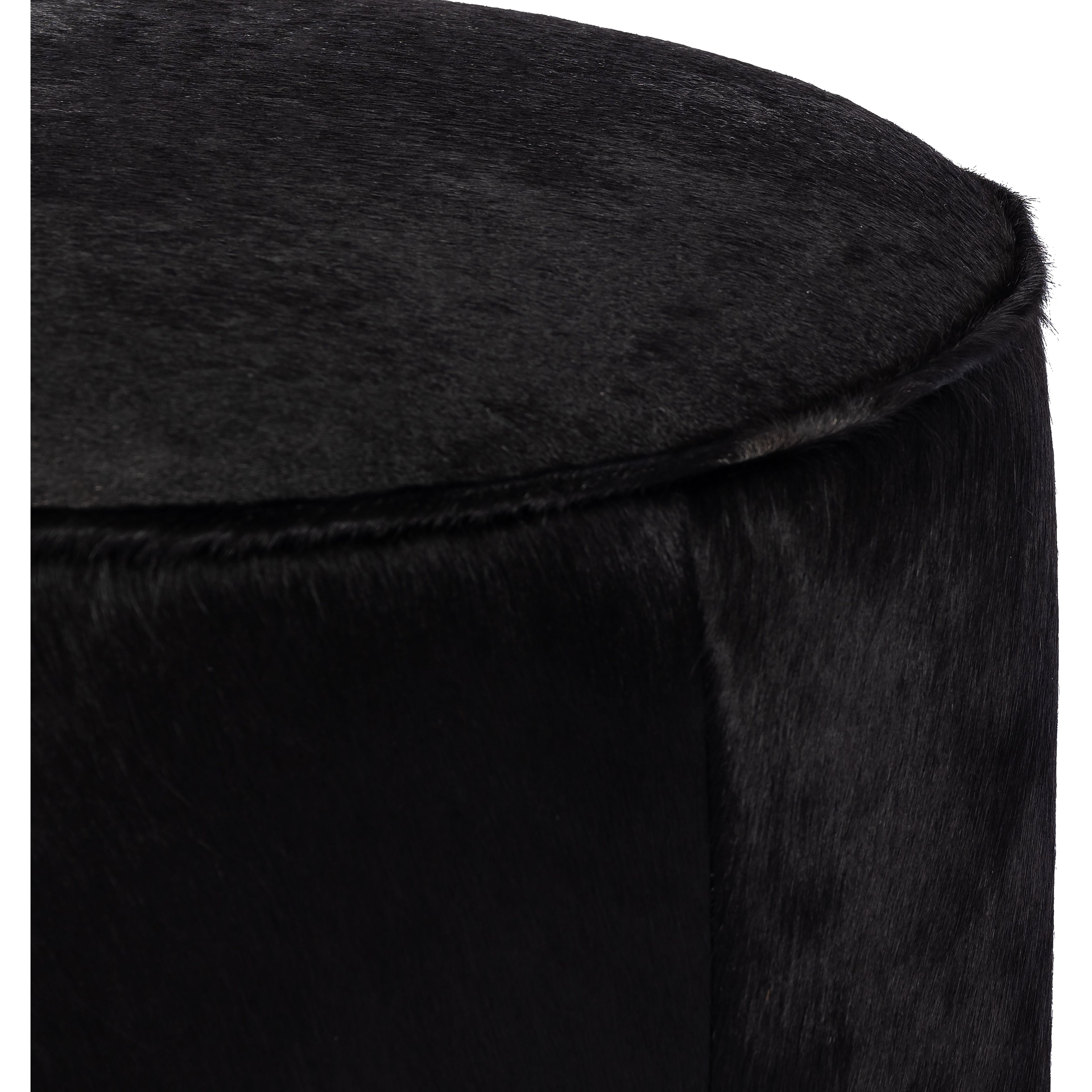 This round ottoman can be placed just about anywhere, bringing with it a hip retro vibe. Covered in soft and luminous black hair-on hide, which is naturally warm and textural with authentic highlights. Amethyst Home provides interior design, new construction, custom furniture, and area rugs in the Omaha metro area.