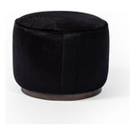 This round ottoman can be placed just about anywhere, bringing with it a hip retro vibe. Covered in soft and luminous black hair-on hide, which is naturally warm and textural with authentic highlights. Amethyst Home provides interior design, new construction, custom furniture, and area rugs in the Washington metro area.
