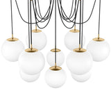 Matte glass spheres float at varying lengths for a statement-making piece. Each globe is individually blown, shaped and sculpted by hand through a one-hour process. Matte glass is specially manufactured to evenly diffuse light. Brass and glass are 98% recyclable. Designed and sustainably crafted in Poland by Schwung.Overall Dimensions62.50"w x 62. Amethyst Home provides interior design, new home construction design consulting, vintage area rugs, and lighting in the Monterey metro area.