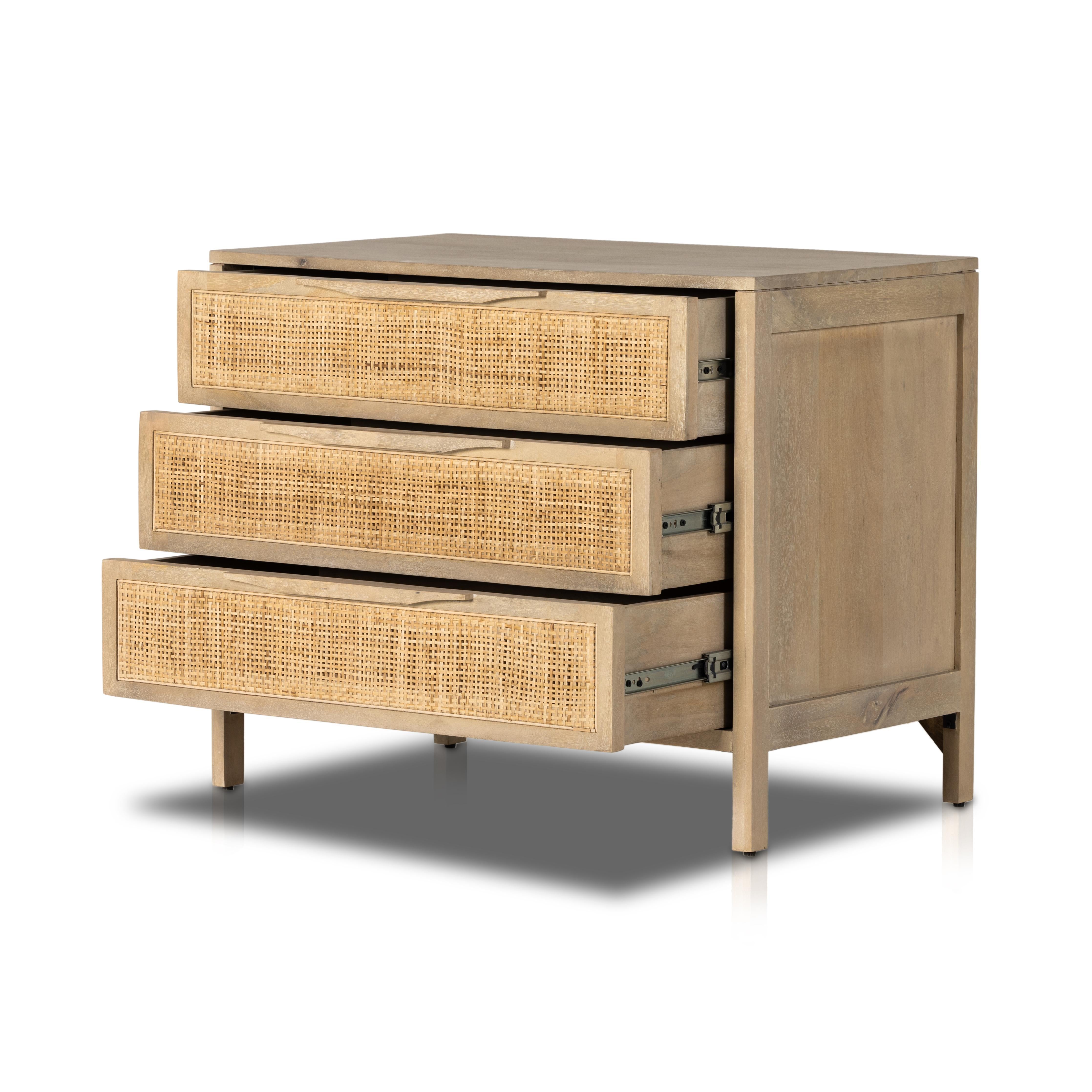 Natural mango frames inset woven cane, for a light, textural look with organic allure. Three spacious drawers provide plenty of closed storage. Amethyst Home provides interior design, new home construction design consulting, vintage area rugs, and lighting in the Calabasas metro area.