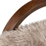 Ethically sourced authentic Mongolian sheepskin covers this unique statement chair, featuring removable feather-foam cushions. A cantilever-like wooden frame pairs with a webbed suspension seat to offer a true sink-in sit Amethyst Home provides interior design, new home construction design consulting, vintage area rugs, and lighting in the Calabasas metro area.