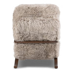 Ethically sourced authentic Mongolian sheepskin covers this unique statement chair, featuring removable feather-foam cushions. A cantilever-like wooden frame pairs with a webbed suspension seat to offer a true sink-in sit Amethyst Home provides interior design, new home construction design consulting, vintage area rugs, and lighting in the Laguna Beach metro area.