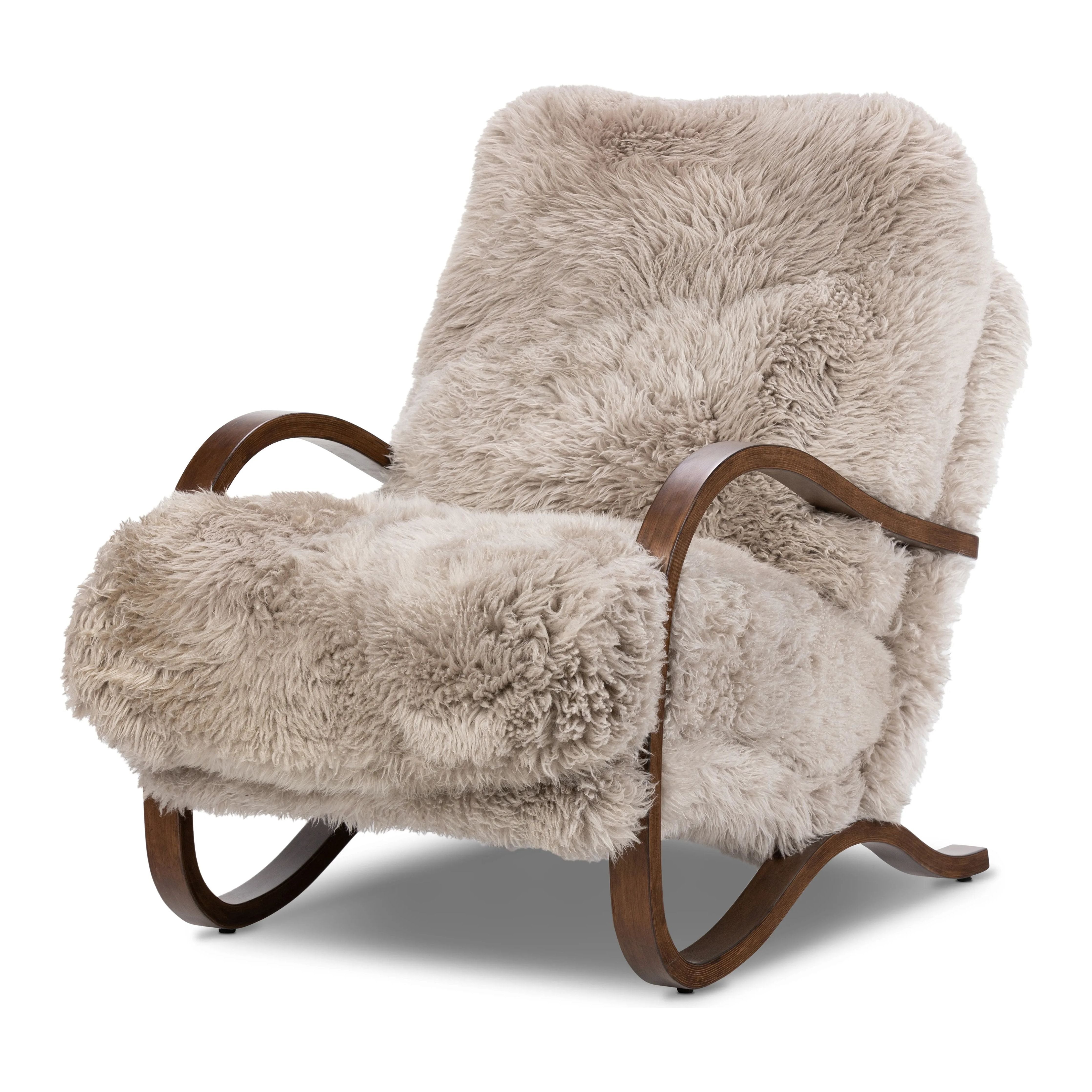 Ethically sourced authentic Mongolian sheepskin covers this unique statement chair, featuring removable feather-foam cushions. A cantilever-like wooden frame pairs with a webbed suspension seat to offer a true sink-in sit Amethyst Home provides interior design, new home construction design consulting, vintage area rugs, and lighting in the Washington metro area.
