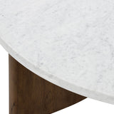 Mixed materials make the table. Thick-cut oak forms a chunky pedestal base for a rounded tabletop of white Italian marble, with beautifully subtle natural veining. Designed in partnership with longtime Four Hands collaborator Thomas Bina and Brazilian designer Ronald Sasson Amethyst Home provides interior design, new home construction design consulting, vintage area rugs, and lighting in the Austin metro area.