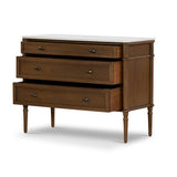 Influenced by vintage European lines, this chest is elegant and full of presence. Framed panels, rounded corners and finished with aged brass drawer pulls and tapered spindle legs for character. Made from solid oak and veneer, finished with a marble top.Collection: Collins Amethyst Home provides interior design, new home construction design consulting, vintage area rugs, and lighting in the Kansas City metro area.