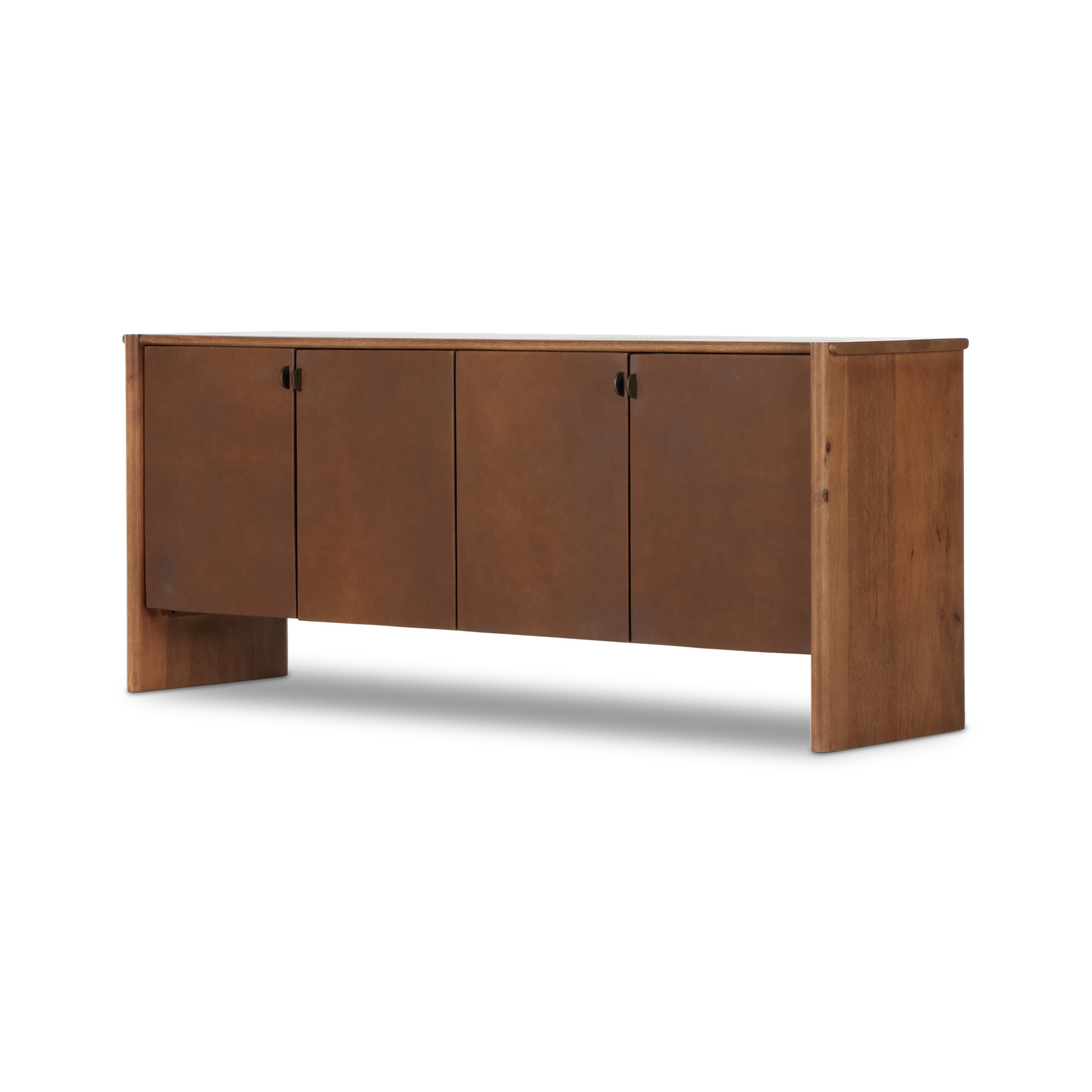 Curved edges and connection points meet leather door fronts, creating a smooth hand feel and look. Rounded offset hardware finishes this mango wood sideboard. Amethyst Home provides interior design, new construction, custom furniture, and area rugs in the Des Moines metro area.