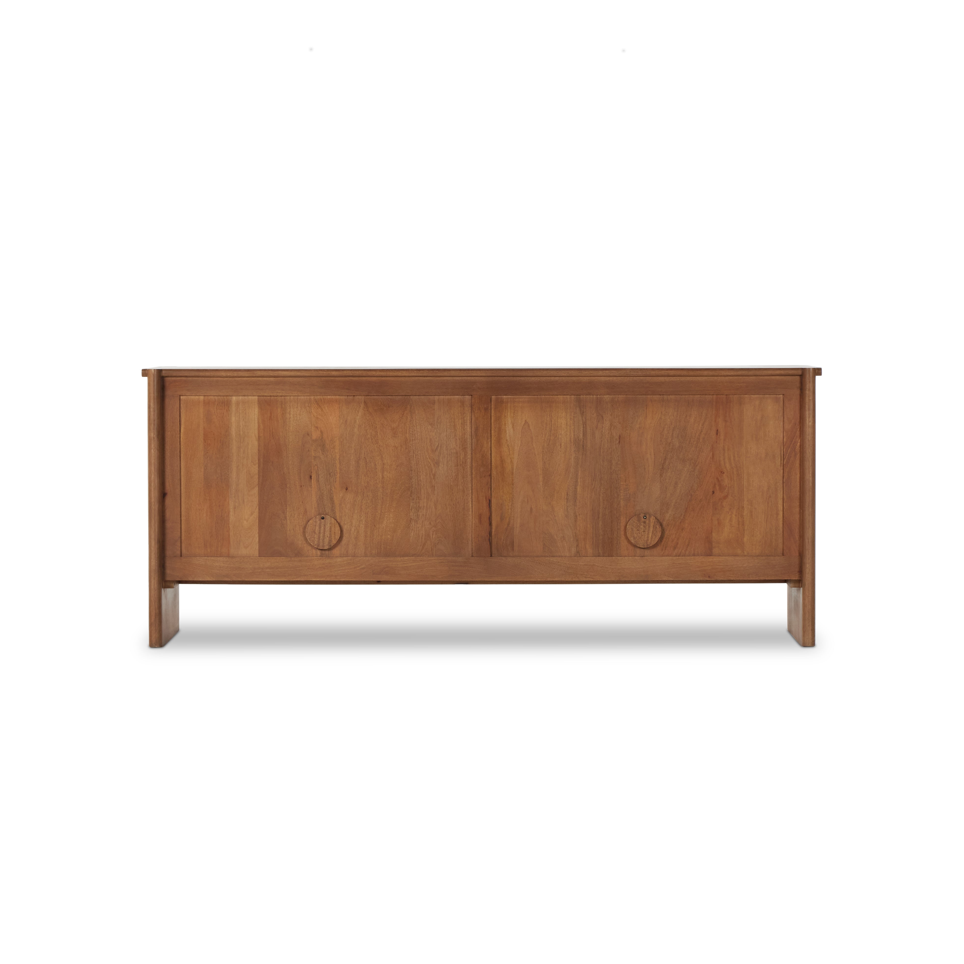 Curved edges and connection points meet leather door fronts, creating a smooth hand feel and look. Rounded offset hardware finishes this mango wood sideboard. Amethyst Home provides interior design, new construction, custom furniture, and area rugs in the Houston metro area.