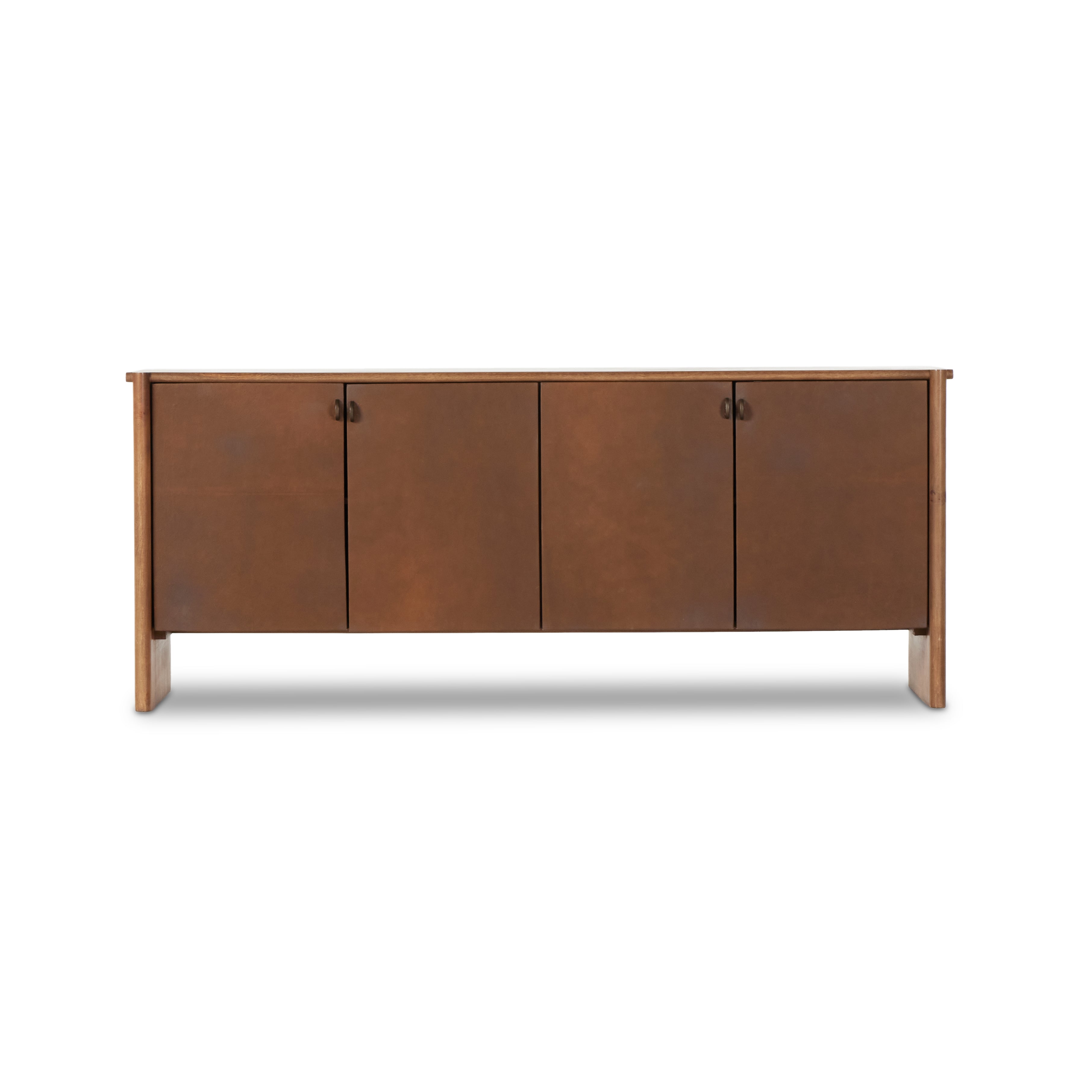 Curved edges and connection points meet leather door fronts, creating a smooth hand feel and look. Rounded offset hardware finishes this mango wood sideboard. Amethyst Home provides interior design, new construction, custom furniture, and area rugs in the Omaha metro area.