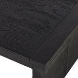 Black-finished oak shapes a streamlined coffee table with a rich while minimalist look.Collection: Bennet Amethyst Home provides interior design, new home construction design consulting, vintage area rugs, and lighting in the Nashville metro area.