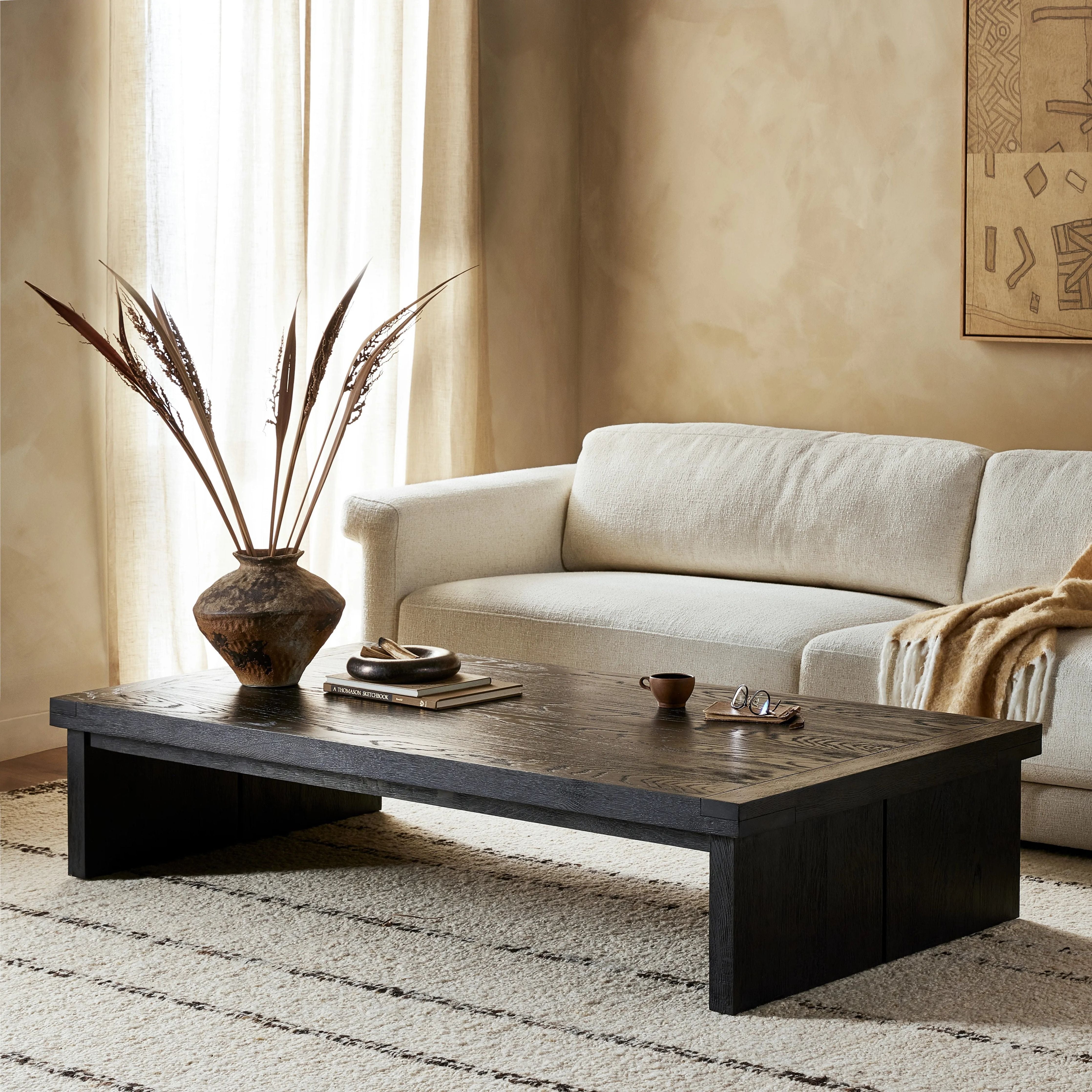 Black-finished oak shapes a streamlined coffee table with a rich while minimalist look.Collection: Bennet Amethyst Home provides interior design, new home construction design consulting, vintage area rugs, and lighting in the Park City metro area.