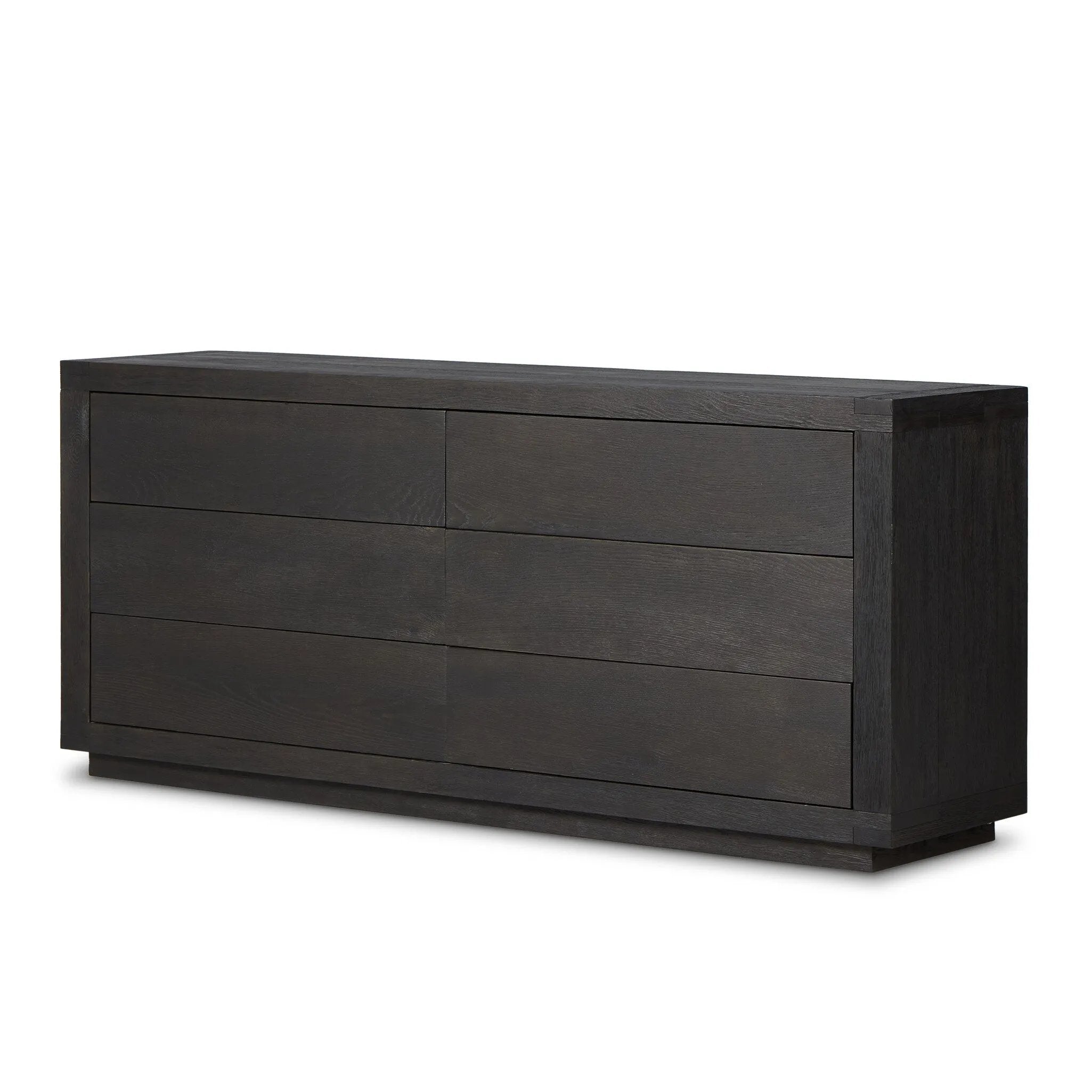 Black-finished oak shapes a streamlined box-style dresser, with lap joint corners for a detail-driven touch.Collection: Bennet Amethyst Home provides interior design, new home construction design consulting, vintage area rugs, and lighting in the Houston metro area.