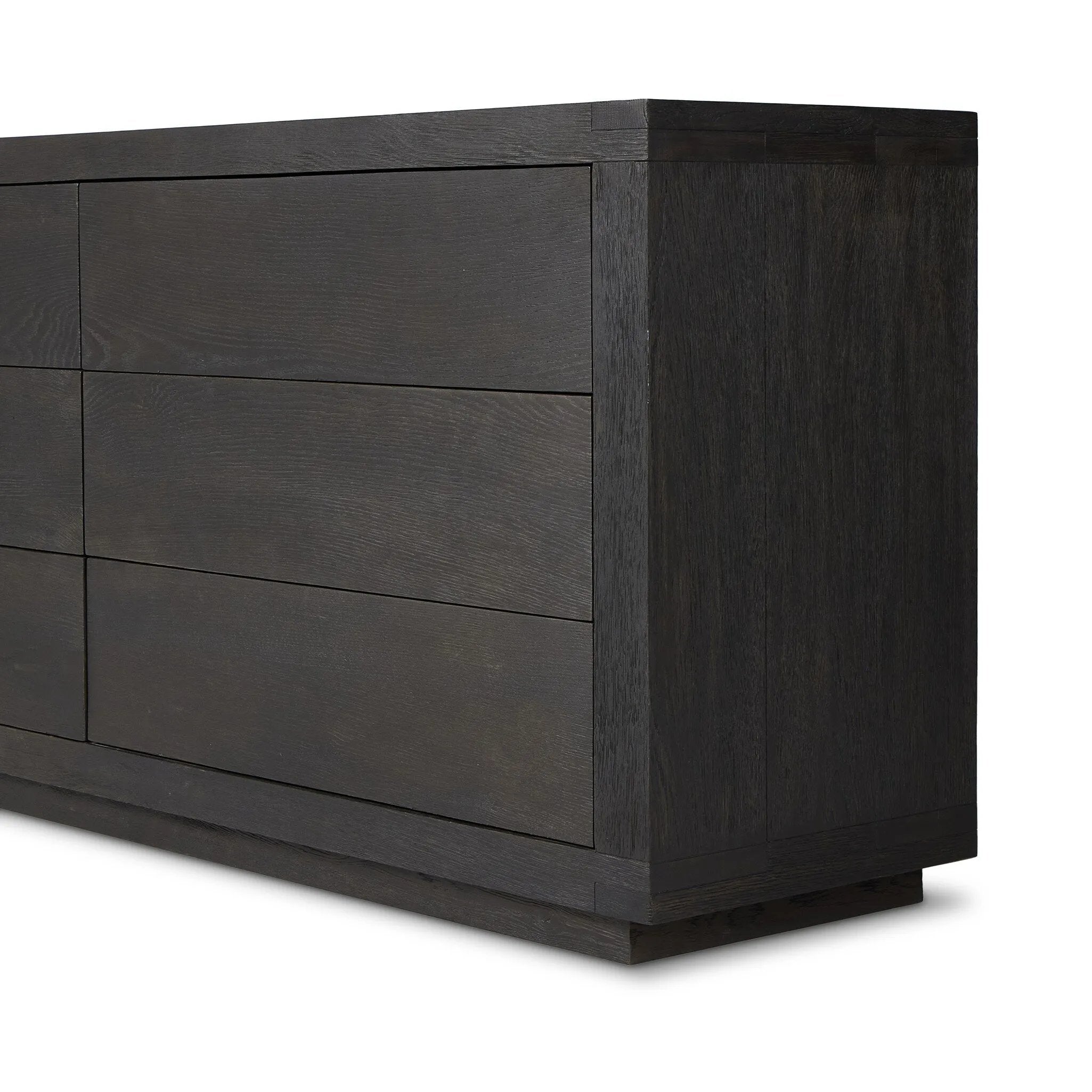 Black-finished oak shapes a streamlined box-style dresser, with lap joint corners for a detail-driven touch.Collection: Bennet Amethyst Home provides interior design, new home construction design consulting, vintage area rugs, and lighting in the Newport Beach metro area.