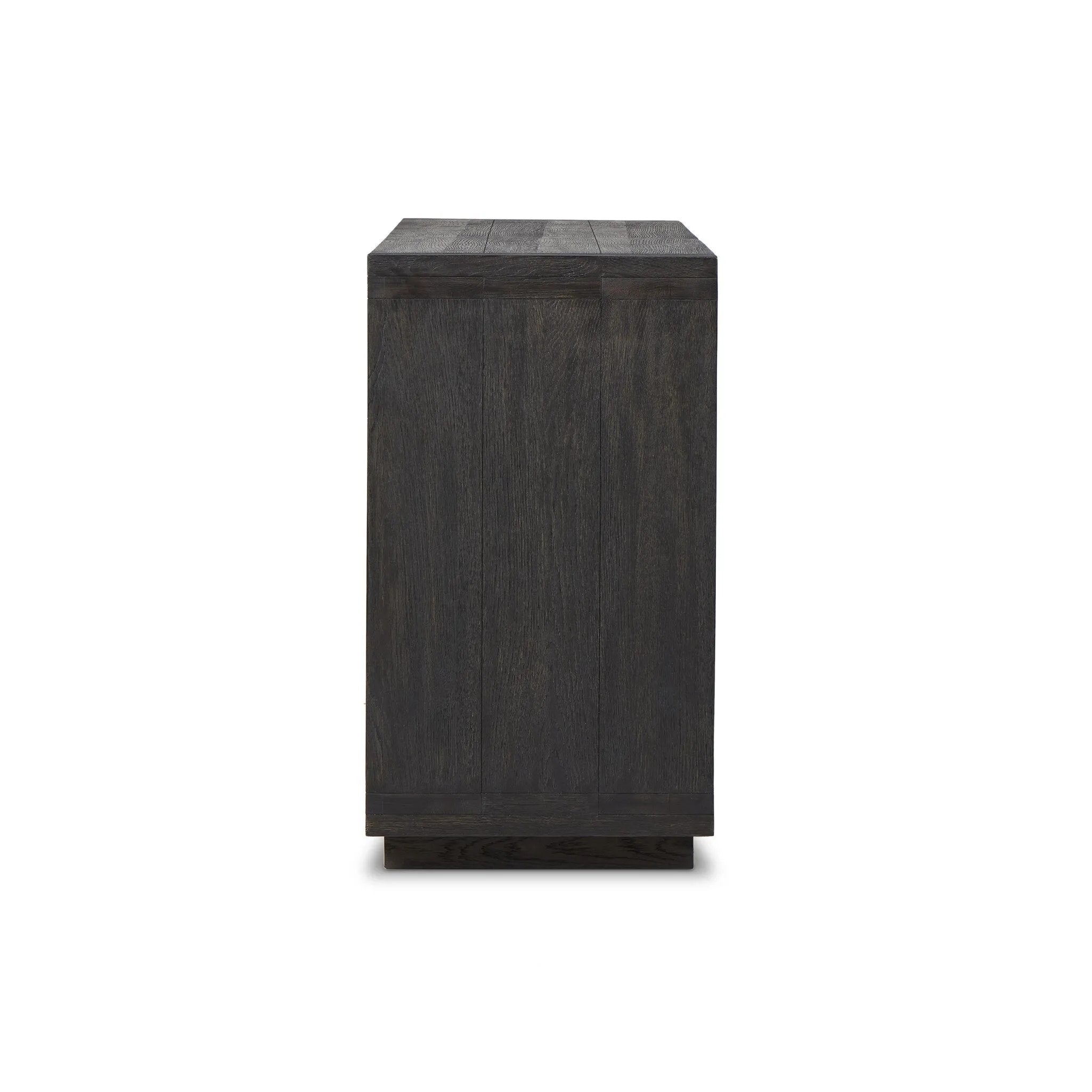 Black-finished oak shapes a streamlined box-style dresser, with lap joint corners for a detail-driven touch.Collection: Bennet Amethyst Home provides interior design, new home construction design consulting, vintage area rugs, and lighting in the Portland metro area.