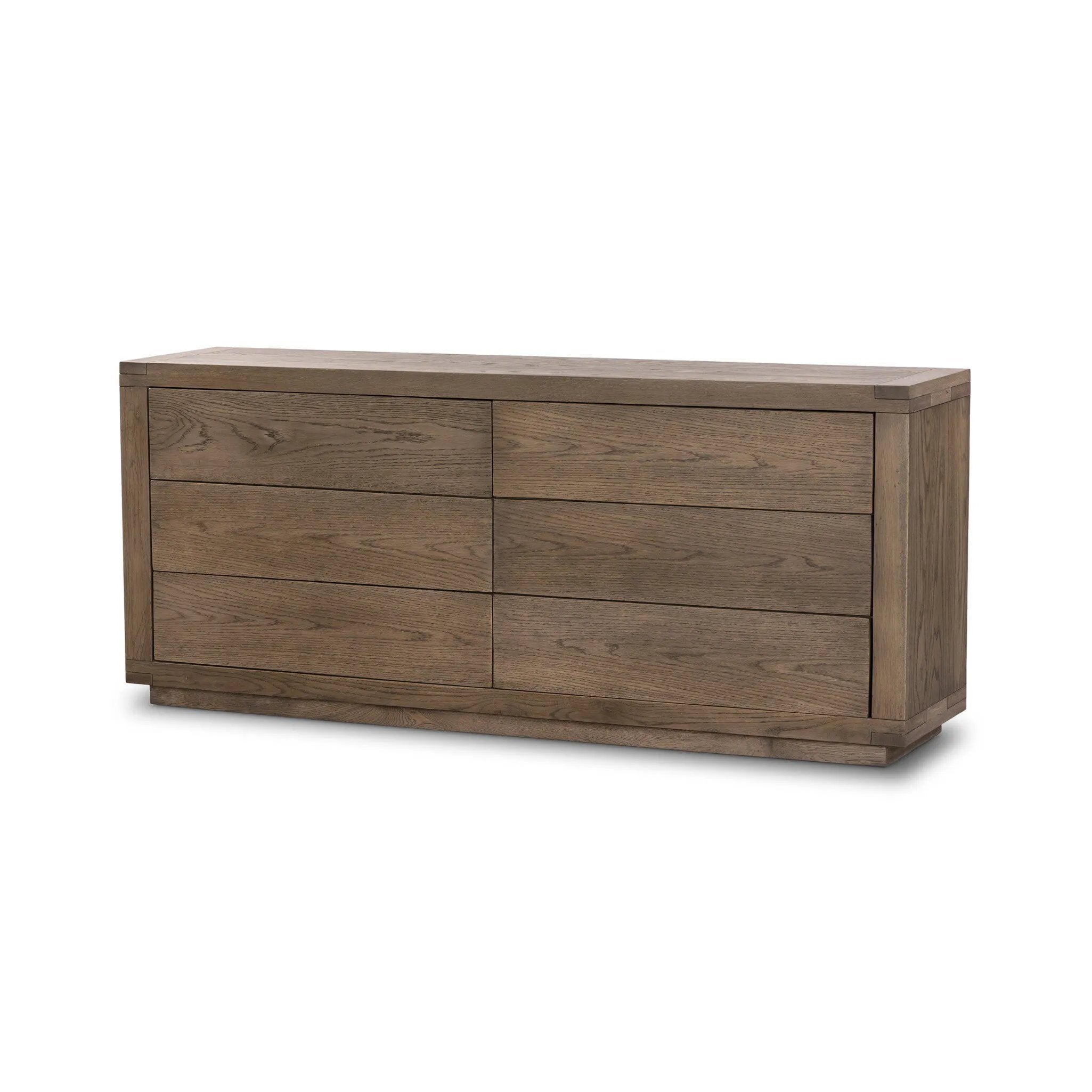 Worn oak shapes a streamlined box-style dresser, with lap joint corners for a detail-driven touch.Collection: Bennet Amethyst Home provides interior design, new home construction design consulting, vintage area rugs, and lighting in the Houston metro area.