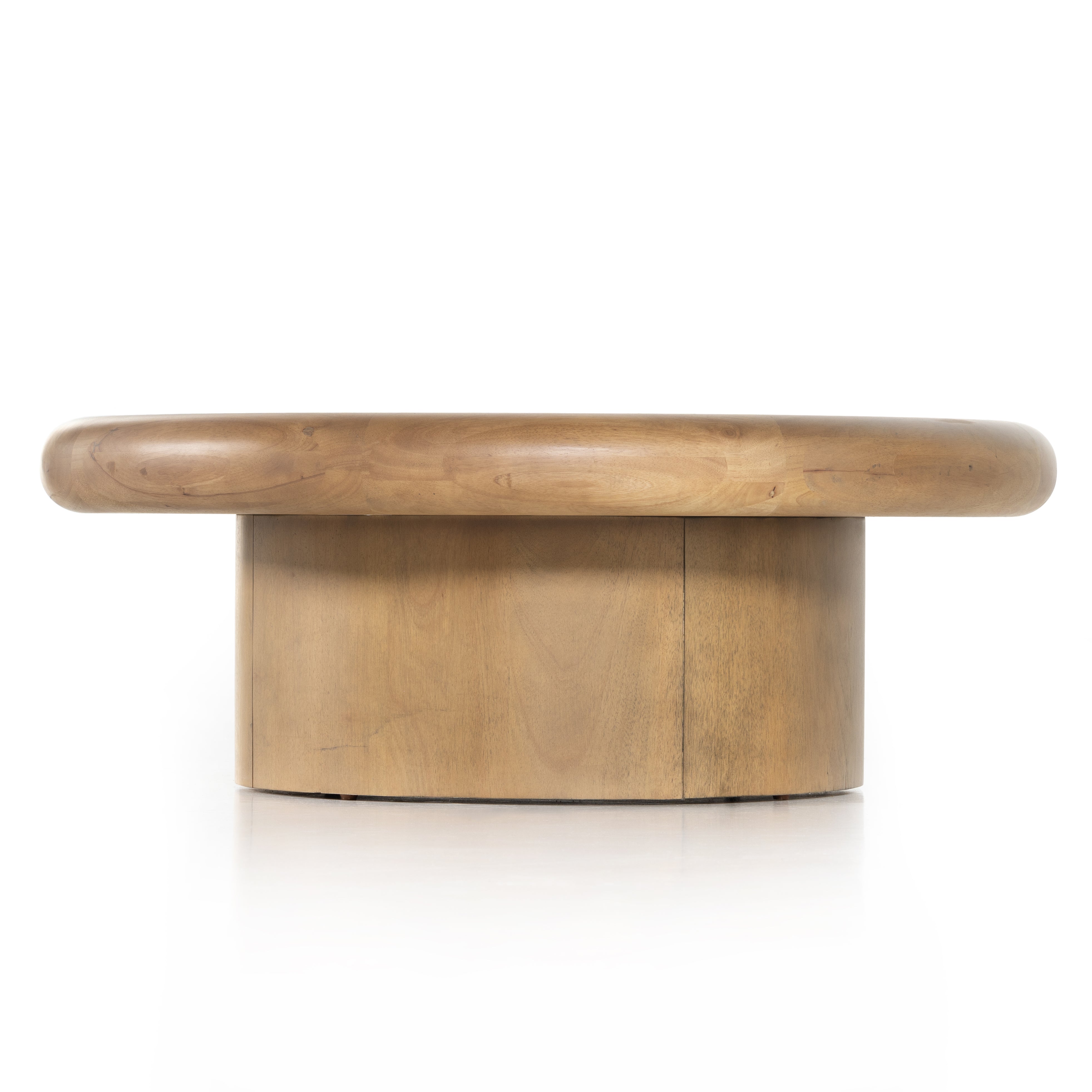 The Zach coffee table in burnished parawood features a pedestal-style base on a rounded tabletop with bullnose edging, for style and softness alike. Amethyst Home provides interior design, furniture, rugs, and design services in the Kansas City metro area.