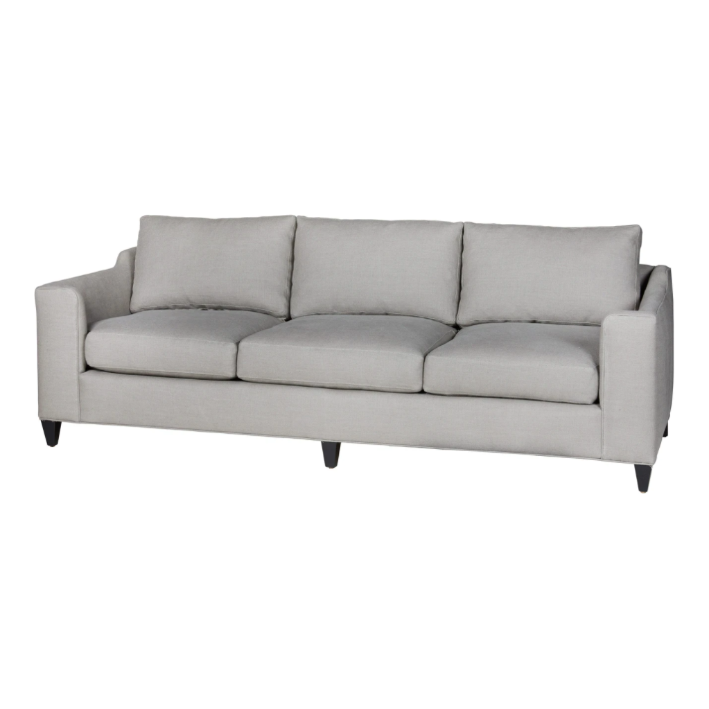 A chic, yet simple design, the Gunner Upholstered Sofa by Cisco Brothers boasts a streamlined frame supported by tapered legs. This sofa is beautifully detailed, with piping on the body and top stitch on cushions. It has a traditional yet sleek look, ideal for entertaining. Photographed in Brevard Pewter.   Overall: 84"w x 36"d x 25"h