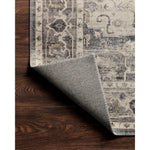Featuring soft motifs in a carefully curated color palate of grey, black, ivory and hints of blue, the Hathaway Steel / Ivory area rug captures the essence of one-of-a-kind vintage or antique area rug. This rug is ideal for high traffic areas such as living rooms, dining rooms, kitchens, hallways, and entryways.