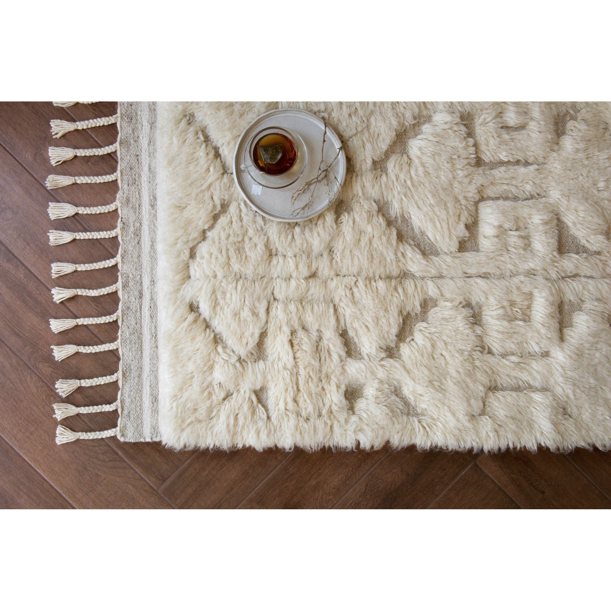 Hygge Oatmeal/Ivory Rug - Amethyst Home Inspired by Scandinavian textile motifs, the Hygge Collection combines a soft shaggy texture with an enduring neutral palette. Each piece is hand-loomed in India of 100% wool, ensuring long-wearing durability in even the busiest of rooms.