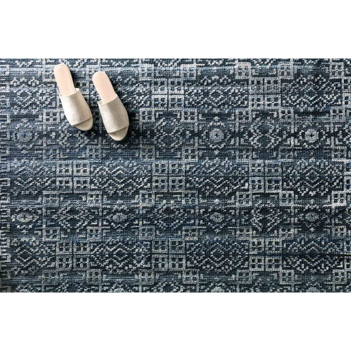 Both timeless and modern, the Idris Ink area rug from Loloi is meticulously hand-knotted in colors of navy, indigo, and grey. The tonal series features an elevated texture, accentuating the pattern in every piece. The Idris Ink Area Rug is hand-knotted with a blend of 70% Viscose and 30% Wool also known as ID-03 Ink.