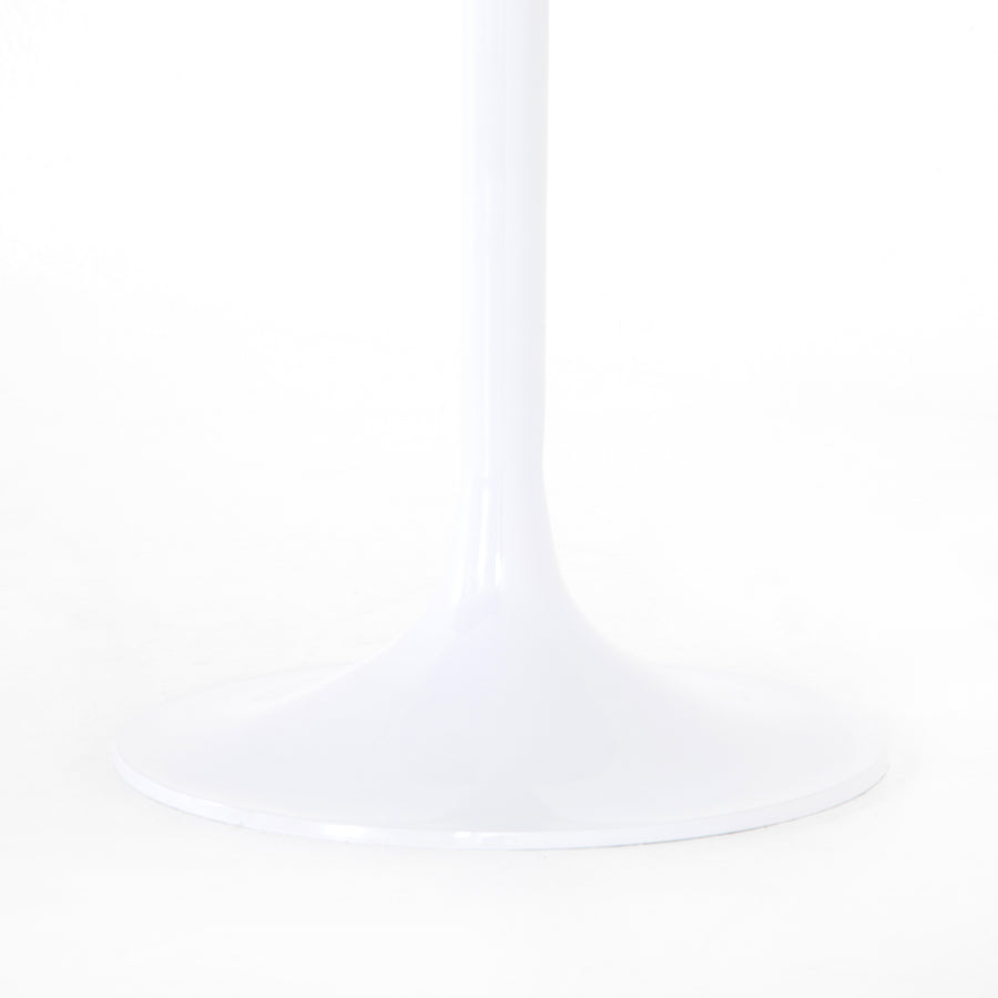 Classic tulip shaping in white cast-aluminum makes for a modern Simone White Bistro Table. Great indoors or out. Cover or store indoors during inclement weather and when not in use.  Overall Dimensions: 42"w x 42"d x 30"h Materials: Aluminum