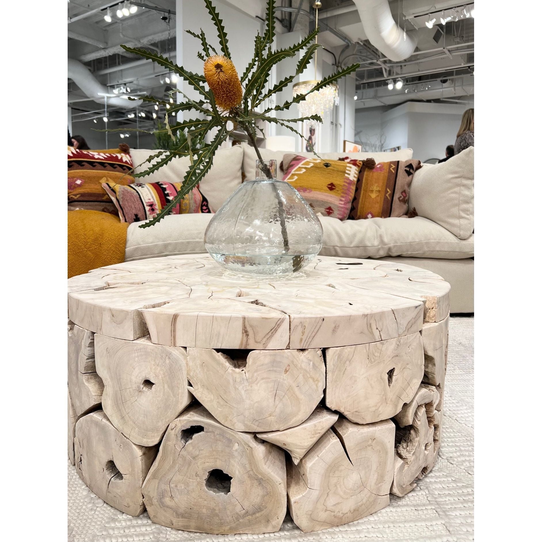 This beautiful Briar Round Coffee Table is pieced together from reclaimed slabs and chunks of solid teak wood finished in a bleached finish with exquisite craftsmanship. Artisans build each coffee table like a puzzle, fitting each piece together in combinations that are never duplicated. Like true works of art, no two will be exactly alike. Amethyst Home provides interior design services, furniture, rugs, and lighting in the Dallas metro area.