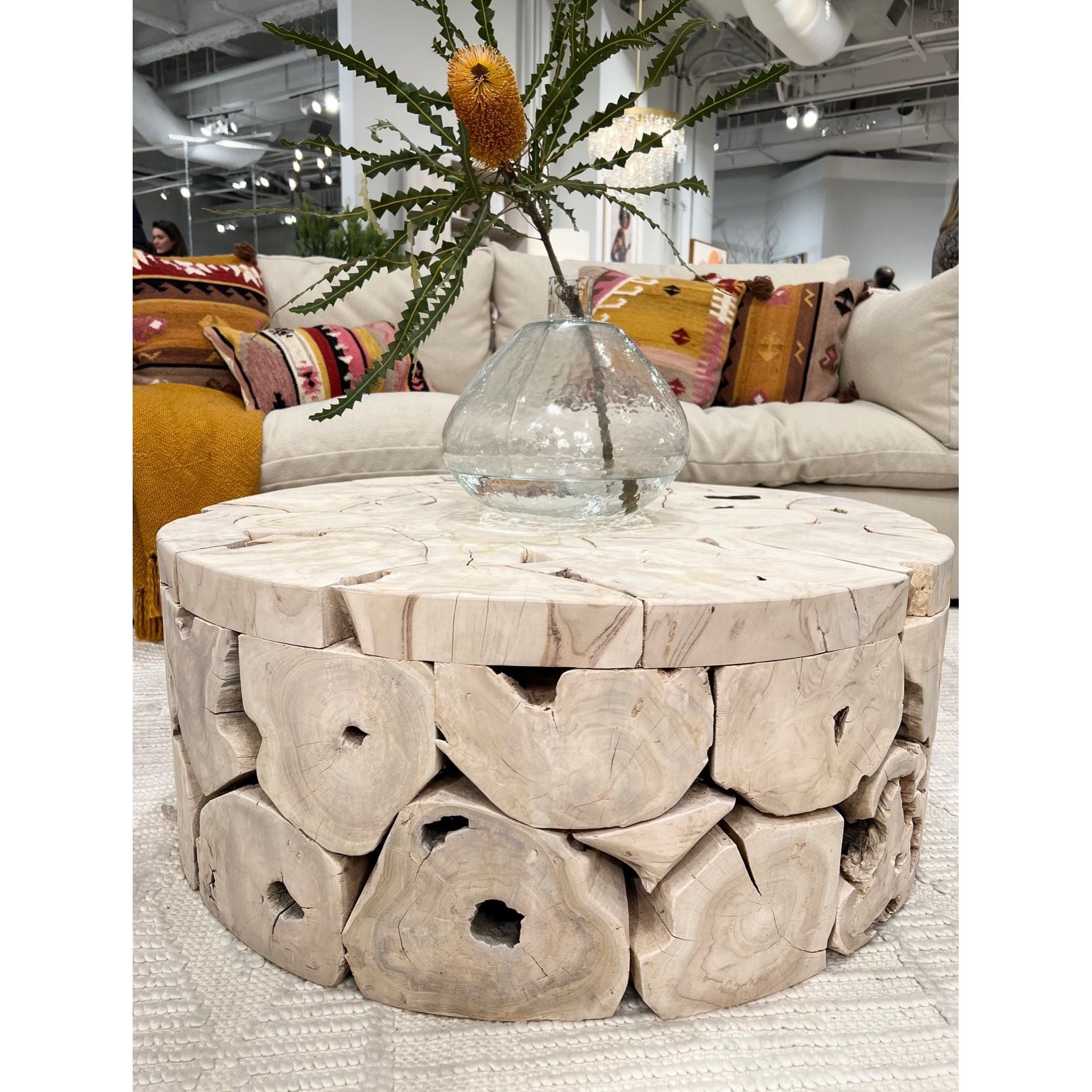This beautiful Briar Round Coffee Table is pieced together from reclaimed slabs and chunks of solid teak wood finished in a bleached finish with exquisite craftsmanship. Artisans build each coffee table like a puzzle, fitting each piece together in combinations that are never duplicated. Like true works of art, no two will be exactly alike. Amethyst Home provides interior design services, furniture, rugs, and lighting in the Omaha metro area.