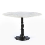 The Lucy Round Marble Dining Table from Four Hands beautifully captures the French industrial meets dining table vibe. Beautifully detailed, 8-sided cast iron pedestal supports a dramatic white marble top with a bull-nosed edge.