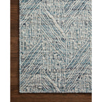 The Raven Blue / Ivory Rug is intricately handwoven with delicate, fine yarns that amplify the rug's layered and dimensional geometric design. While the rug itself is thick and sturdy, the colors and patterns have a casual lightness that can work in many spaces, from busy living rooms to serene bedrooms. Amethyst Home provides interior design, new construction, custom furniture, and area rugs in the Washington metro area.