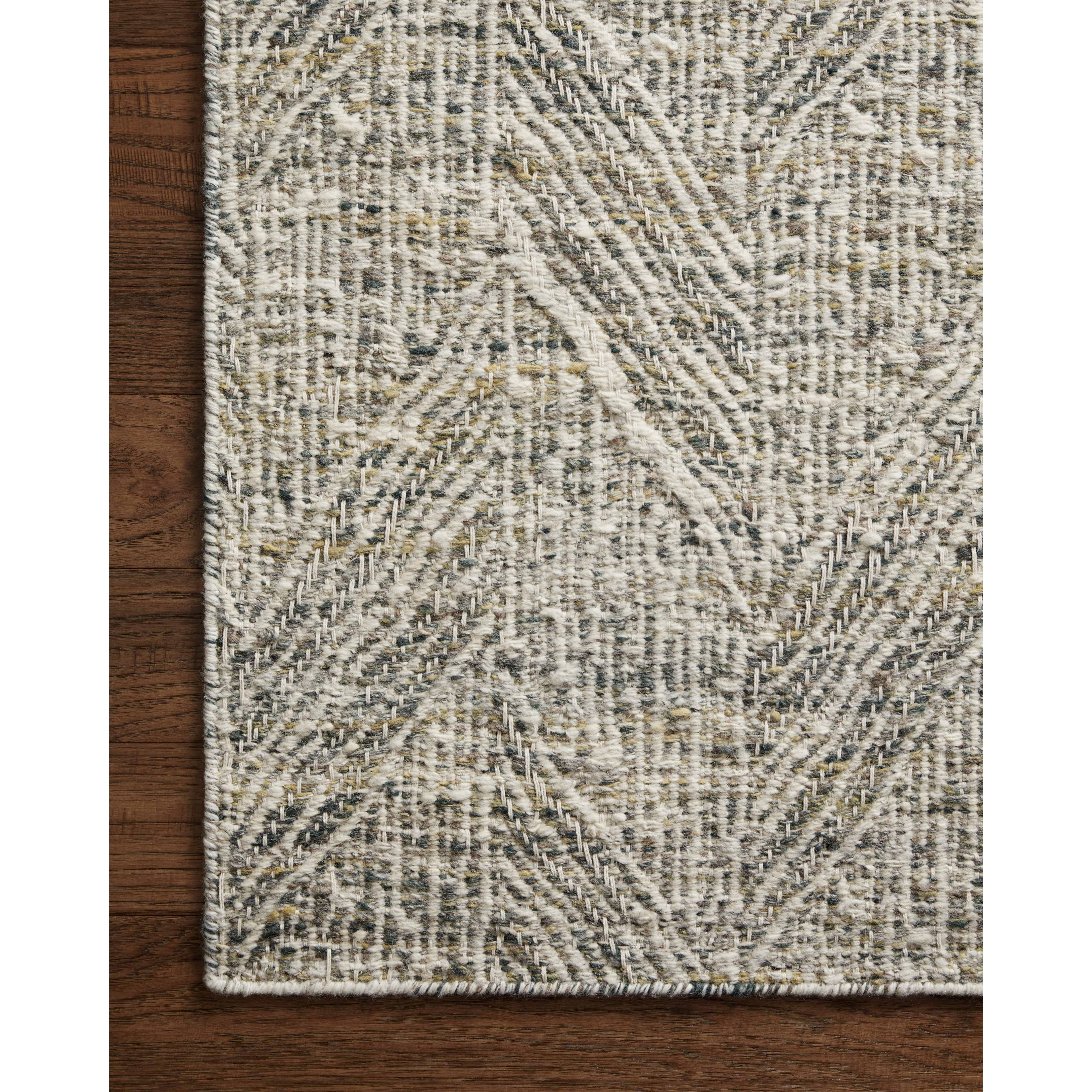 The Raven Moss / Ivory Rug is intricately handwoven with delicate, fine yarns that amplify the rug's layered and dimensional geometric design. While the rug itself is thick and sturdy, the colors and patterns have a casual lightness that can work in many spaces, from busy living rooms to serene bedrooms. Amethyst Home provides interior design, new construction, custom furniture, and area rugs in the Monterey metro area.