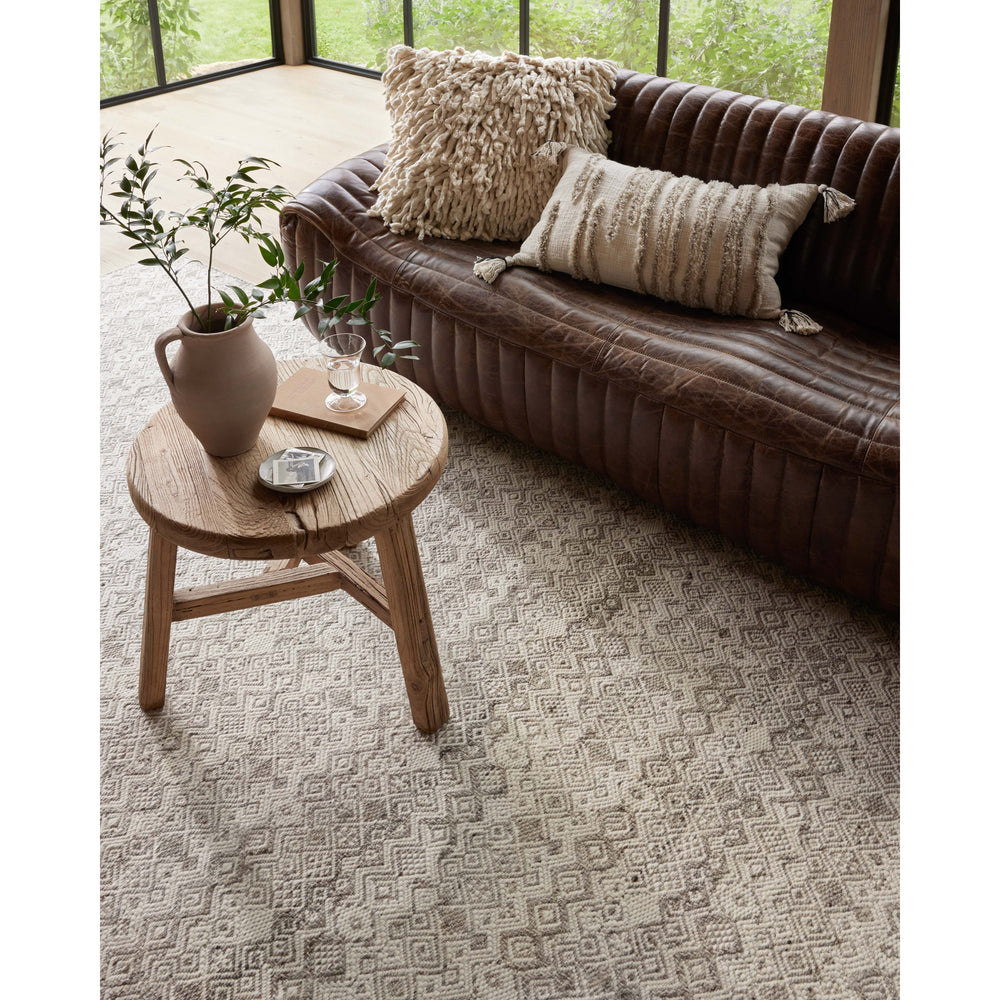 Featuring Raven Dove / Ivory Rug by Loloi at Amethyst Home. The Raven Dove / Ivory Rug is intricately handwoven with delicate, fine yarns that amplify the rug's layered and dimensional geometric design. While the rug itself is thick and sturdy, the colors and patterns have a casual lightness that can work in many spaces, from busy living rooms to serene bedrooms. The Raven Dove / Iv. Amethyst Home provides interior design, new construction, custom furniture, and area rugs in the Austin metro area.