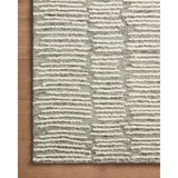 Hand-crafted with a combination of thick and fine yarns, the Tallulah Stone / Ivory Rug area rug creates dynamic dimension in living rooms, bedrooms, and more. The thicker yarns define the abstract, linear design, giving the rug a distinct high-low texture and sense of movement. Tallulah's soft, neutral palettes have a depth of tone inspired by watercolor pigmentation. Amethyst Home provides interior design, new construction, custom furniture, and area rugs in the Laguna Beach metro area.