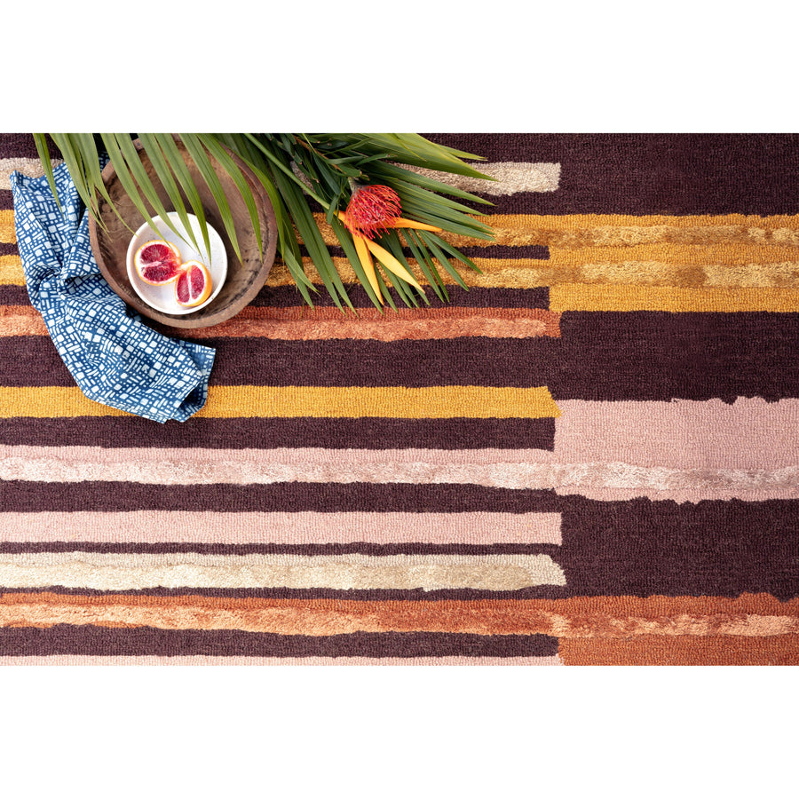 The Jamila Spice/Bordeaux Area Rug is a wool hooked, viscose pile made by artisans in India and offers next level bohemian and eclectic designs. With playful tassels and bold yet current colors, it instantly adds personality in any space. Perfect for your bedroom, bathroom, or other low traffic areas of your home. 