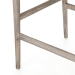 Modern curves redefine the classic wishbone-style counter stool. Vintage white all-weather wicker is woven for a dose of fresh texture within weathered grey teak framing. Cover or store indoors during inclement weather and when not in use.  Pictured in Weathered Grey. Also available in Black Teak and Matte Sealed Teak.  Overall Size: 21.50"w x 22.50"d x 38.50"h Seat Depth: 18.25" Seat Height: 26.50"