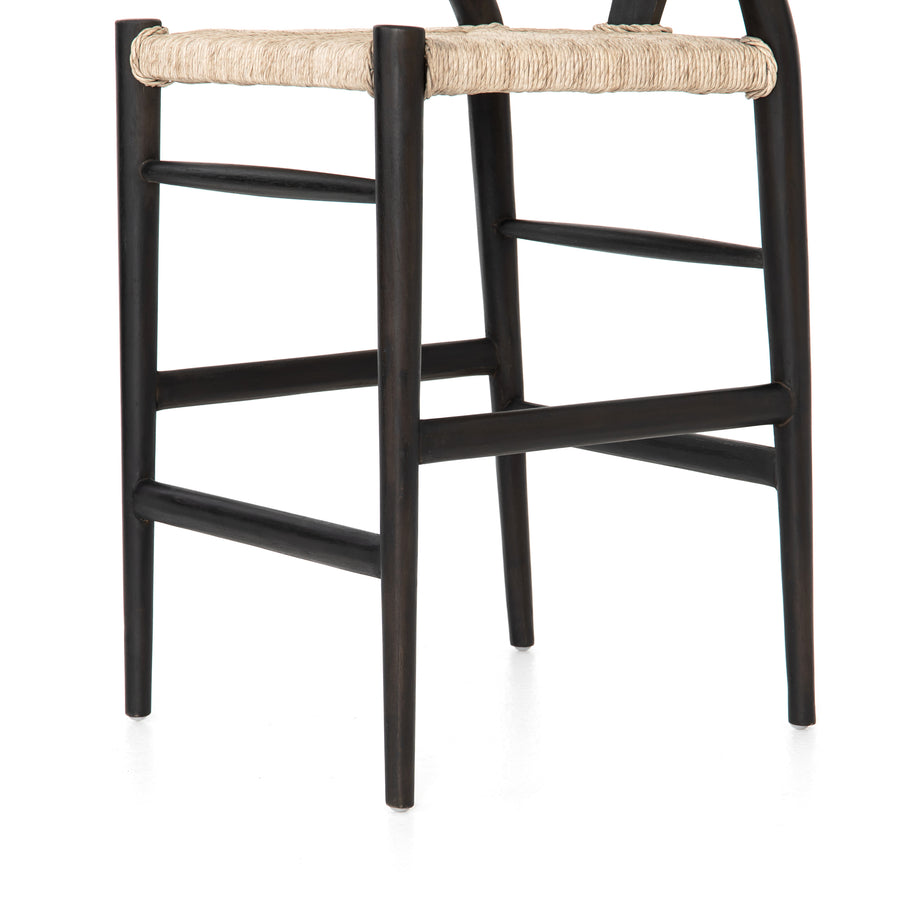 Modern curves redefine the classic wishbone-style counter stool. Vintage white all-weather wicker is woven for a dose of fresh texture within weathered grey teak framing. Cover or store indoors during inclement weather and when not in use.  Pictured in Black Teak. Also available in Weathered Grey and Matte Sealed Teak.  Overall Size: 21.50"w x 22.50"d x 38.50"h Seat Depth: 18.25" Seat Height: 26.50"