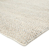 Contemporary and versatile, the eco-friendly Rebecca collection offers a sophisticated distressed solid design to high-traffic areas and outdoor spaces. The Limon area rug delivers a fresh accent to patios, kitchens, and dining rooms with its ultra-durable Pet yarn hand-woven construction. The ivory and gray colorway lends a light and airy tone to any home.