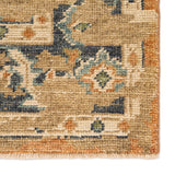 The Rhapsody Cadenza Honey Ginger Rug by Jaipur Living, or RHA02, showcases a distressed center medallion in in orange, blue, and light green on a neutral beige ground. This durable wool hand knotted rug is perfect for the living room, entry way, or other high traffic areas. 
