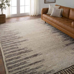 Inspired by textiles from the Tullu region in Morocco, the Patra area rug showcases a linear design in neutral shades of cream, taupe, brown, and gray. This high-piled accent lends warmth and comfort to any space with durable wool hand-knotted onto a cotton foundation. Braided fringe trims the edges for a touch of boho charm. Amethyst Home provides interior design, new home construction design consulting, vintage area rugs, and lighting in the Des Moines metro area.