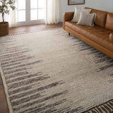 Featuring Alpine Patra Hand-Knotted Rug by Jaipur Living at Amethyst Home. Inspired by textiles from the Tullu region in Morocco, the Patra area rug showcases a linear design in neutral shades of cream, taupe, brown, and gray. This high-piled accent lends warmth and comfort to any space with durable wool hand-knotted onto a cotton foundation. Braided fring. Amethyst Home provides interior design, new home construction design consulting, vintage area rugs, and lighting in the Des Moines metro area.