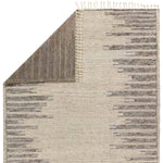 Featuring Alpine Patra Hand-Knotted Rug by Jaipur Living at Amethyst Home. Inspired by textiles from the Tullu region in Morocco, the Patra area rug showcases a linear design in neutral shades of cream, taupe, brown, and gray. This high-piled accent lends warmth and comfort to any space with durable wool hand-knotted onto a cotton foundation. Braided fringe tri. Amethyst Home provides interior design, new home construction design consulting, vintage area rugs, and lighting in the Tampa metro area.