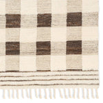 The Desouk Berkshire melds modern allure with the global vibes of Morocco. The Berkshire hand-knotted rug showcases a geometric grid pattern with contrasting brown, cream, and tan tones. This handcrafted rug boasts plush, cut wool pile that pairs beautifully with braided tassel details. Amethyst Home provides interior design, new home construction design consulting, vintage area rugs, and lighting in the Dallas metro area.